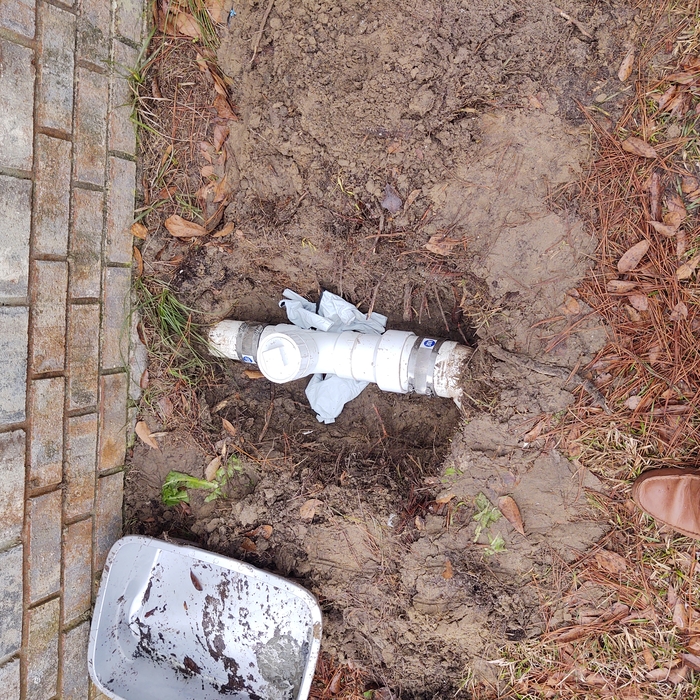 Repaired sewer line with clean out