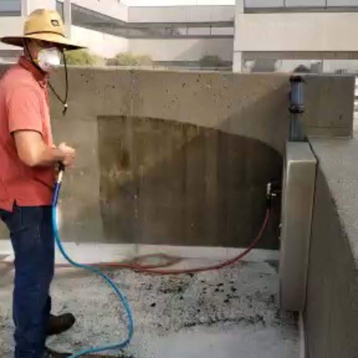 Pressure Washing Building Parking Lot