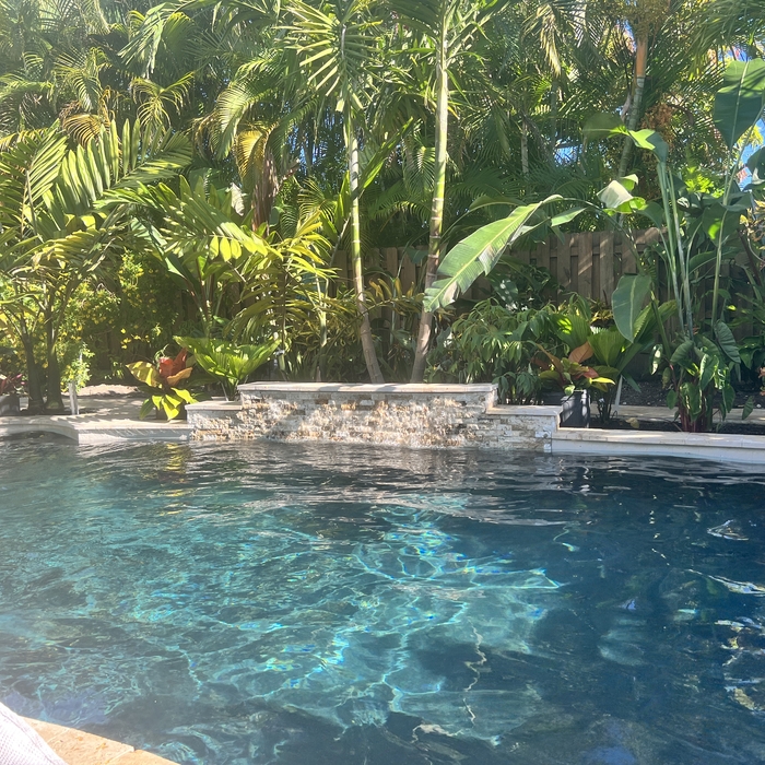 Updated Stack Stone Waterfall and Travertine Tile