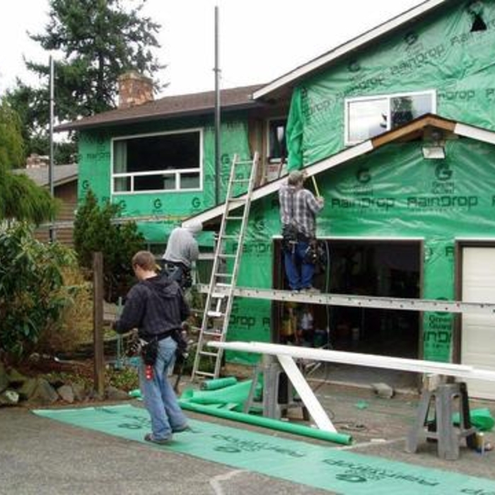 Vinyl siding installation during