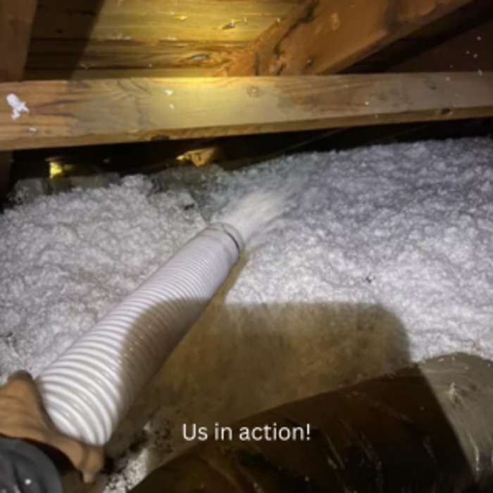 Blown in insulation at work