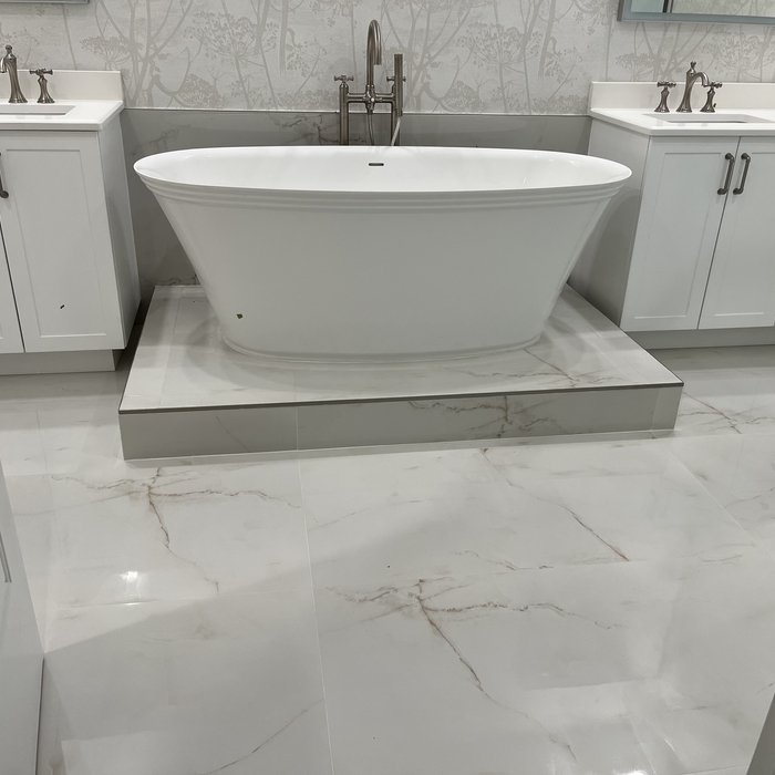 Soaking tub on porcelain tile platform