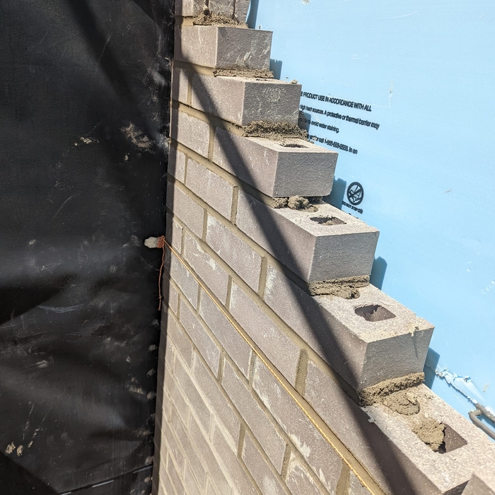 Lead on brick wall