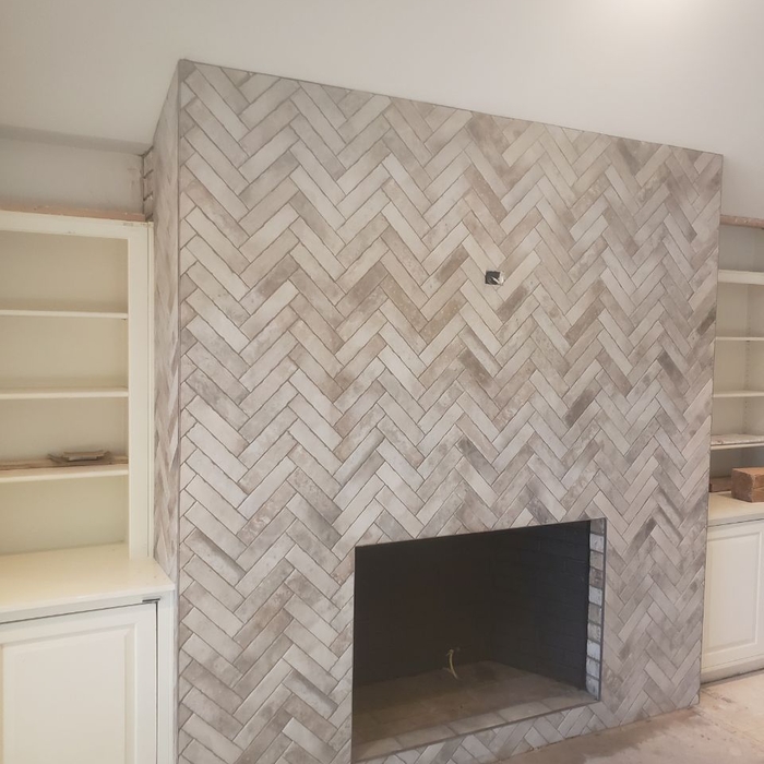 LAYING TILES ON THE FIREPLACE