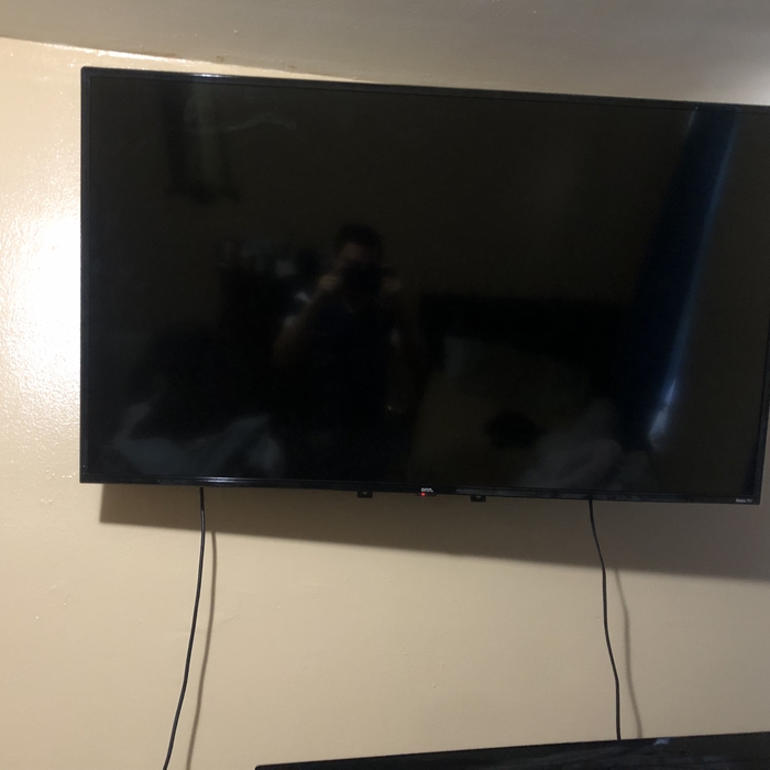 50&quot; roku tv mounted on a wall