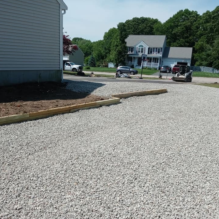 Gravel driveway and parking pad