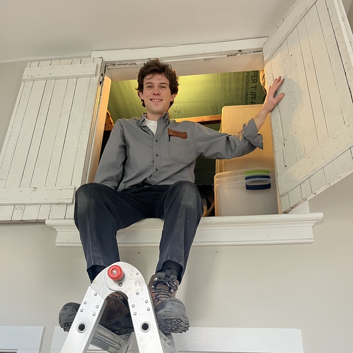 Nate in a crawlspace