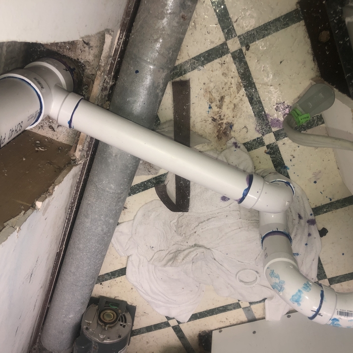 Commercial washer drain line repair.