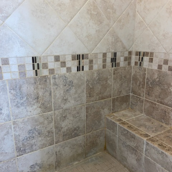 shower walls cleaned, sealed, and recaulked