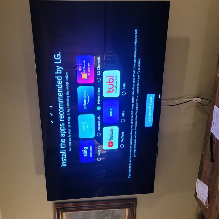 Wall mounted 77 inch TV