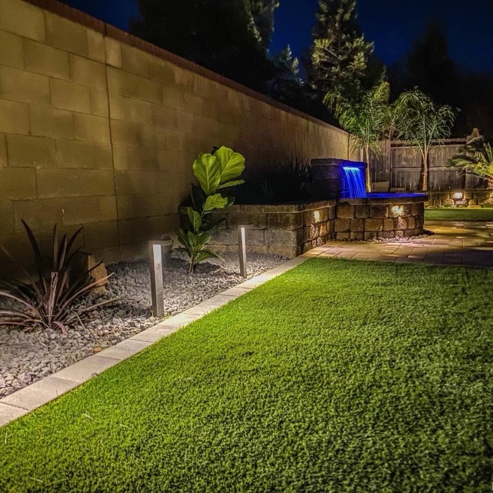 Turf with water feature and landscape lighting