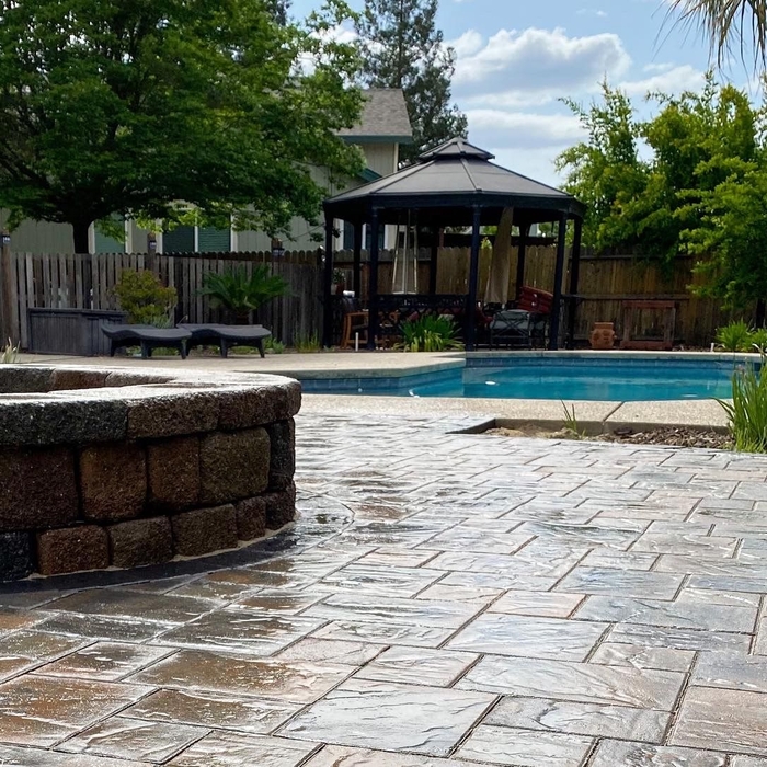 Pavers and firepit around the pool