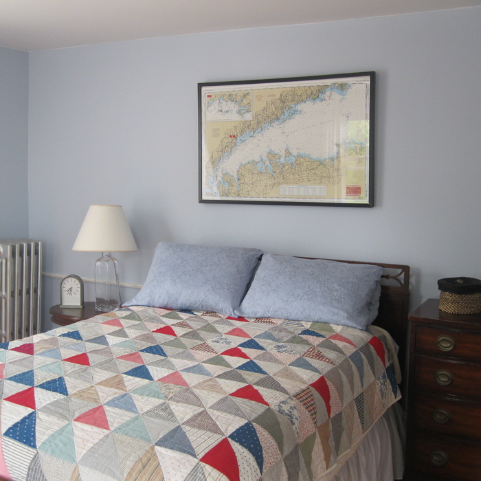Bedroom with cozy quilt and minimal accessories