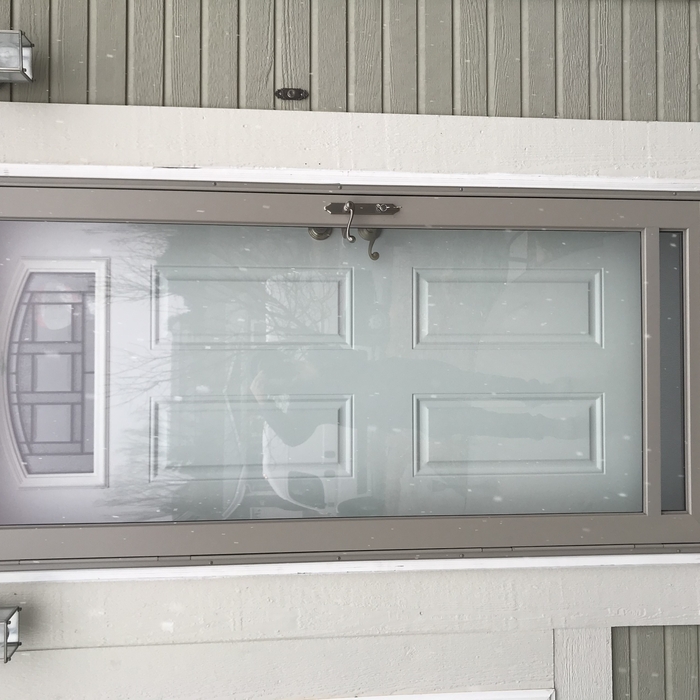 Front door with storm door.