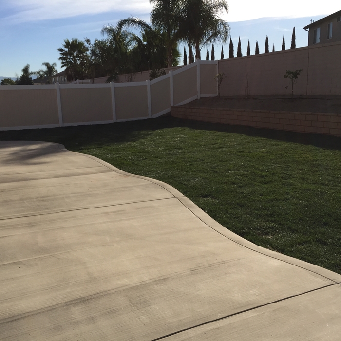 Grey concrete and tall fescue sod