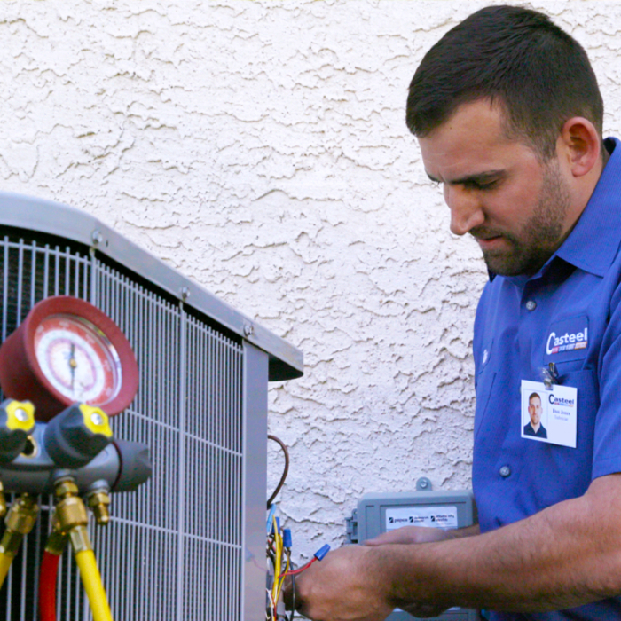 Casteel HVAC Tech testing a condenser