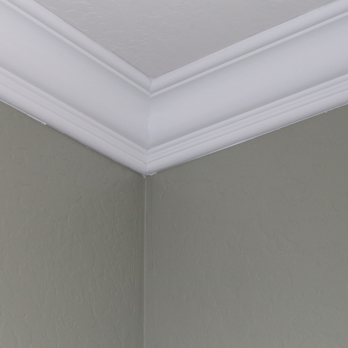 Crown molding installation in living room