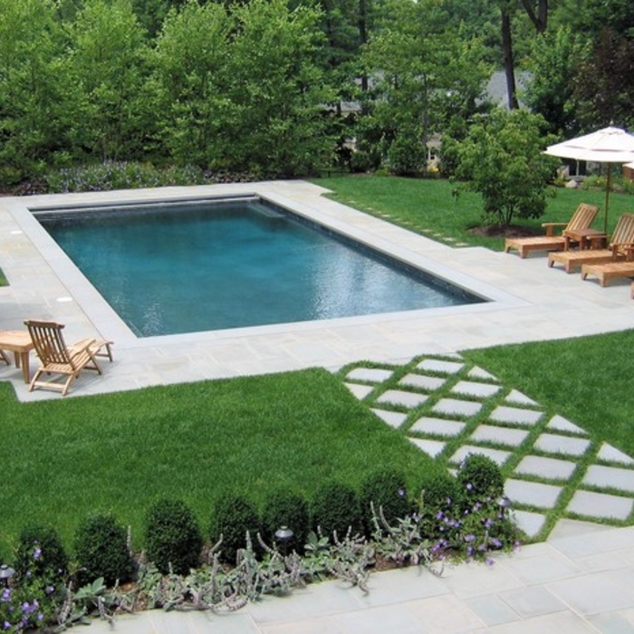 gunite swimming pool and stone patio