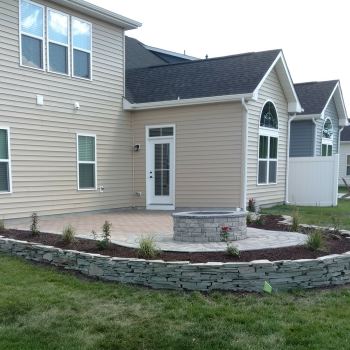 Patio firepit with stack stone wall