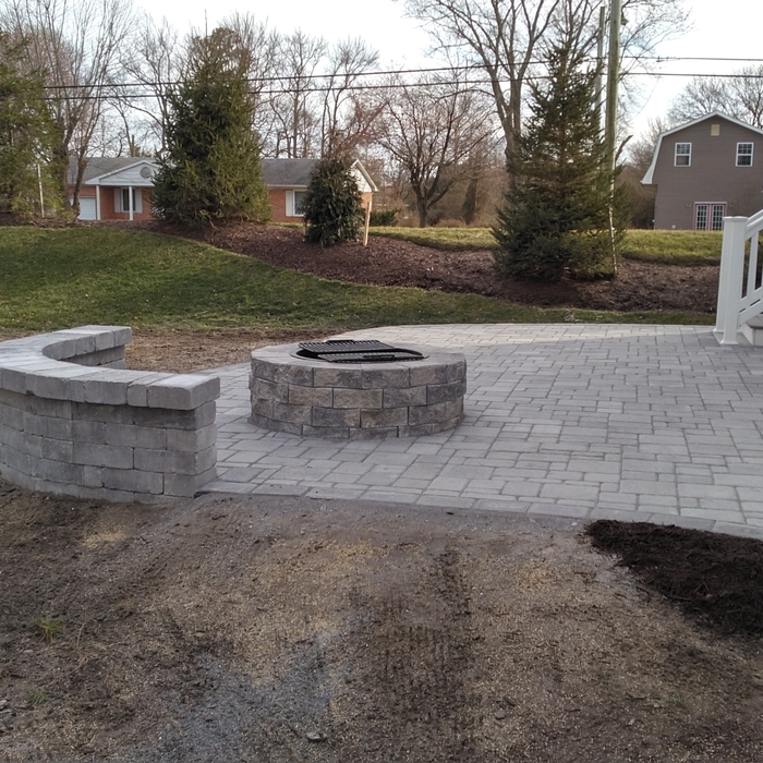Paver patio with fire pit and sitting wall