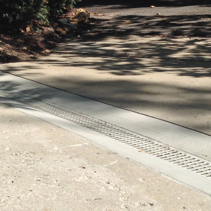 Driveway grated drain cut-in