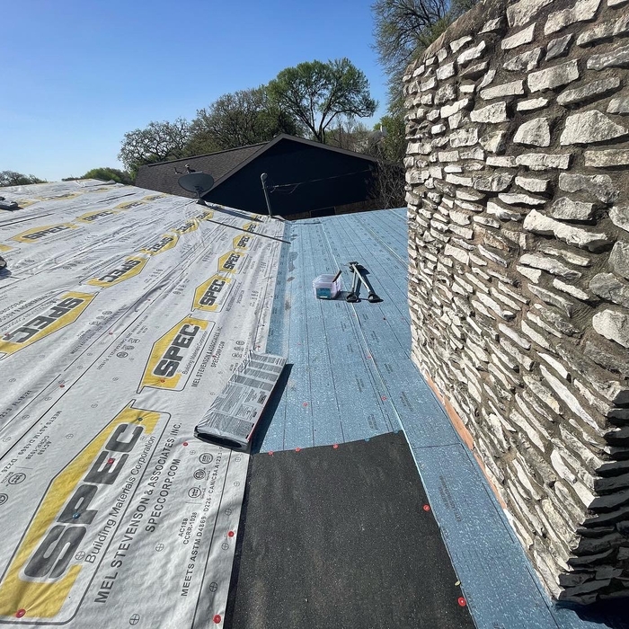 Applying Underlayment for reroof project