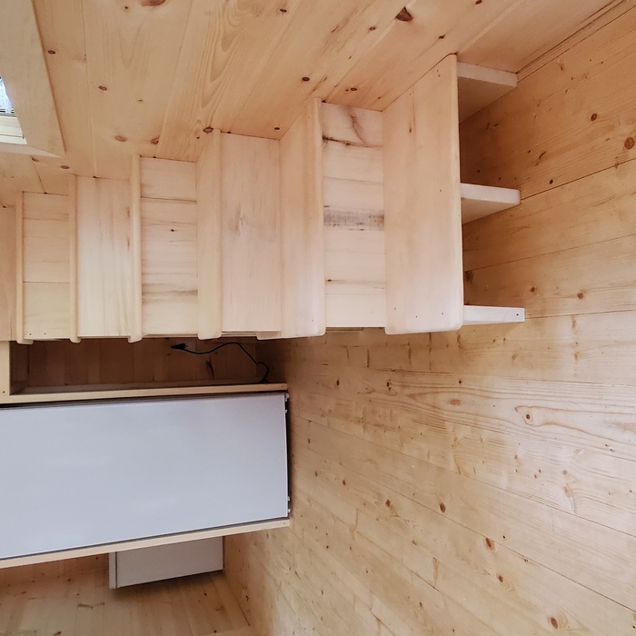 Staircase with storage built with salvages lumber