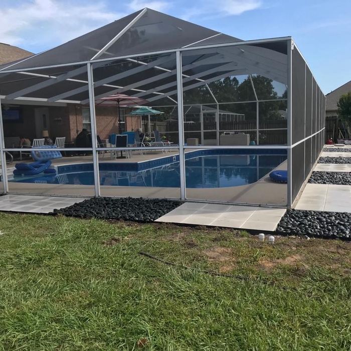 Pavers and rocks around pool area