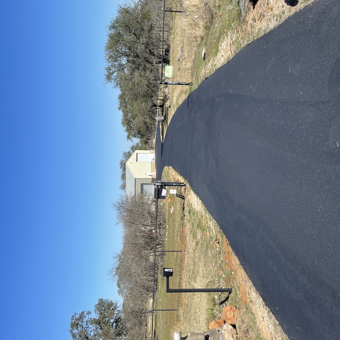 Asphalt sealcoating