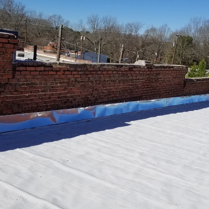 Commercial roof coating with new flashing!