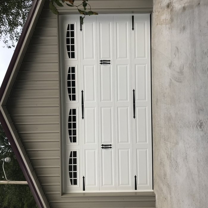 Beautiful carrige style door with decorative Hardw