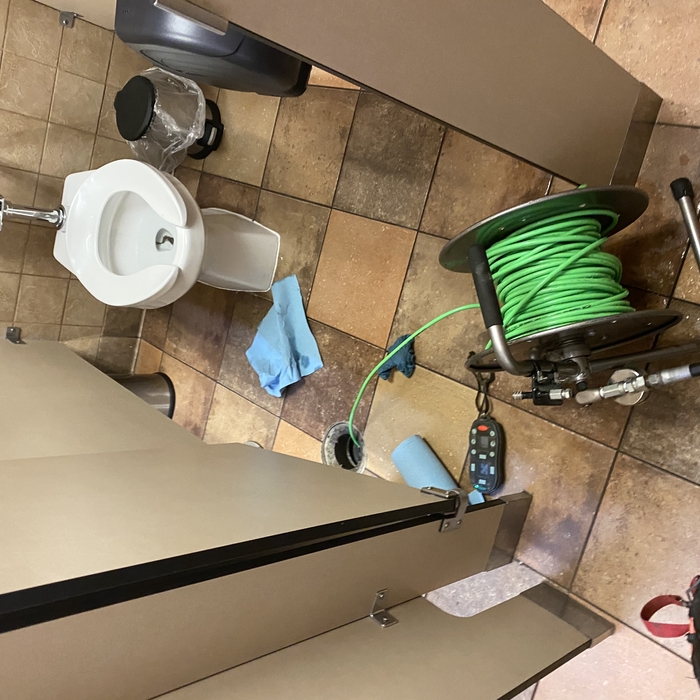 Commercial bathroom drain cleaning