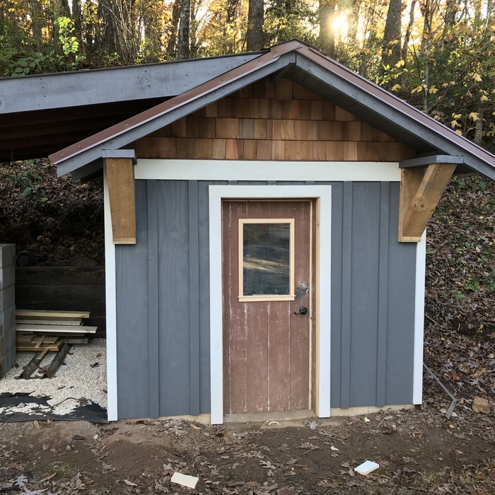 Cedar shakes, board + batt siding and beam bracket