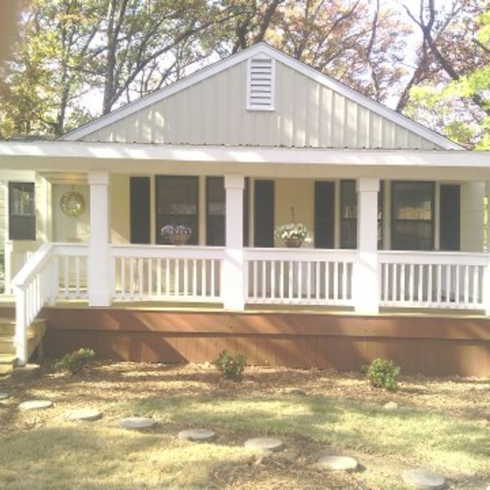 Front of remodel with new porch and Richard R.I.P.