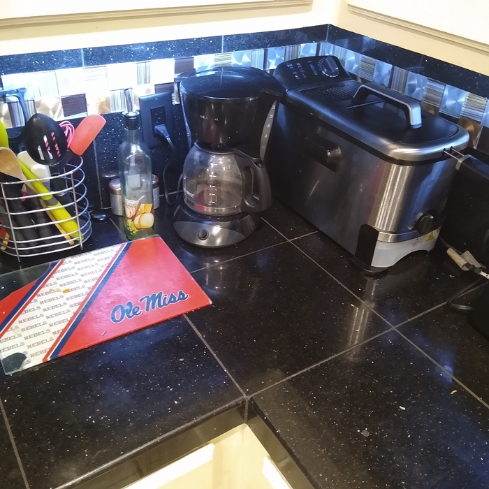 Black Galaxy with feature strip in backsplash