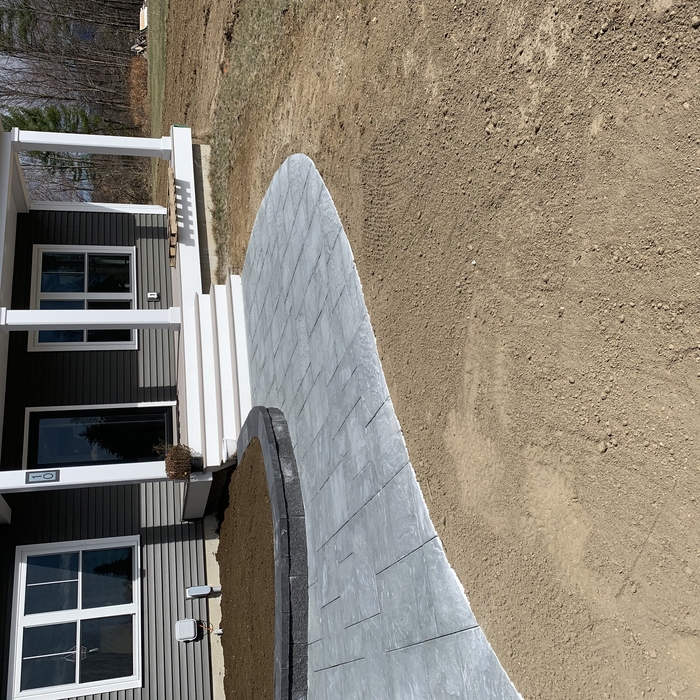 Front entry walkway, with a garden retaining wall