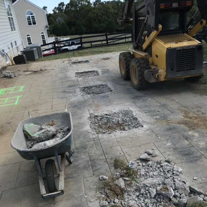 Excavating footing holes in existing patio