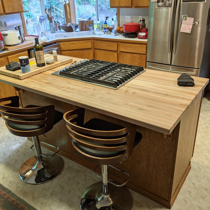 With butcher block and new gas downdraft range