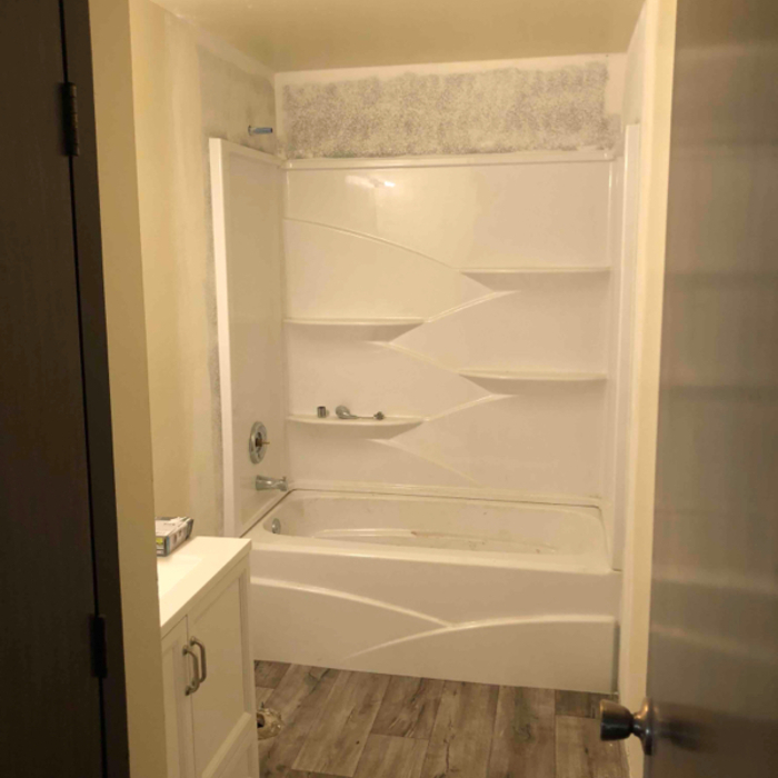 Tub/shower installed &amp; textured walls